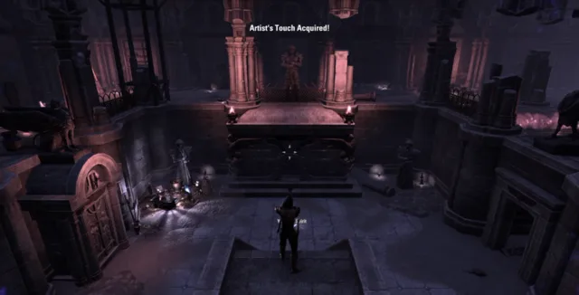 Player at the top of the stairs facing the statue holding a sword, with columns on both sides