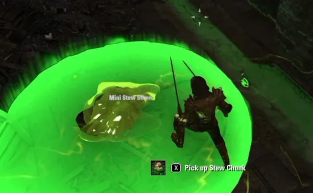 The Pick up Stew Chunk prompt next to a dead Mini Stew Slime